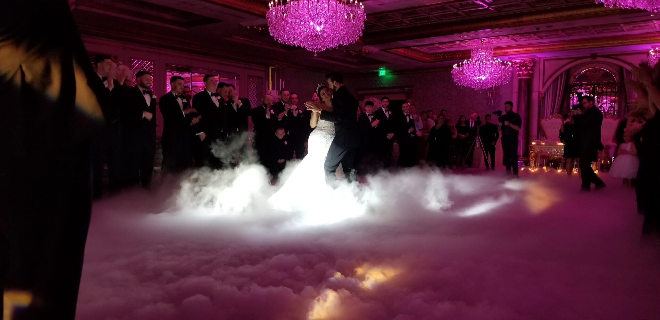 A wedding first dance surrounded by an All Generations dancing-on-clouds effect.