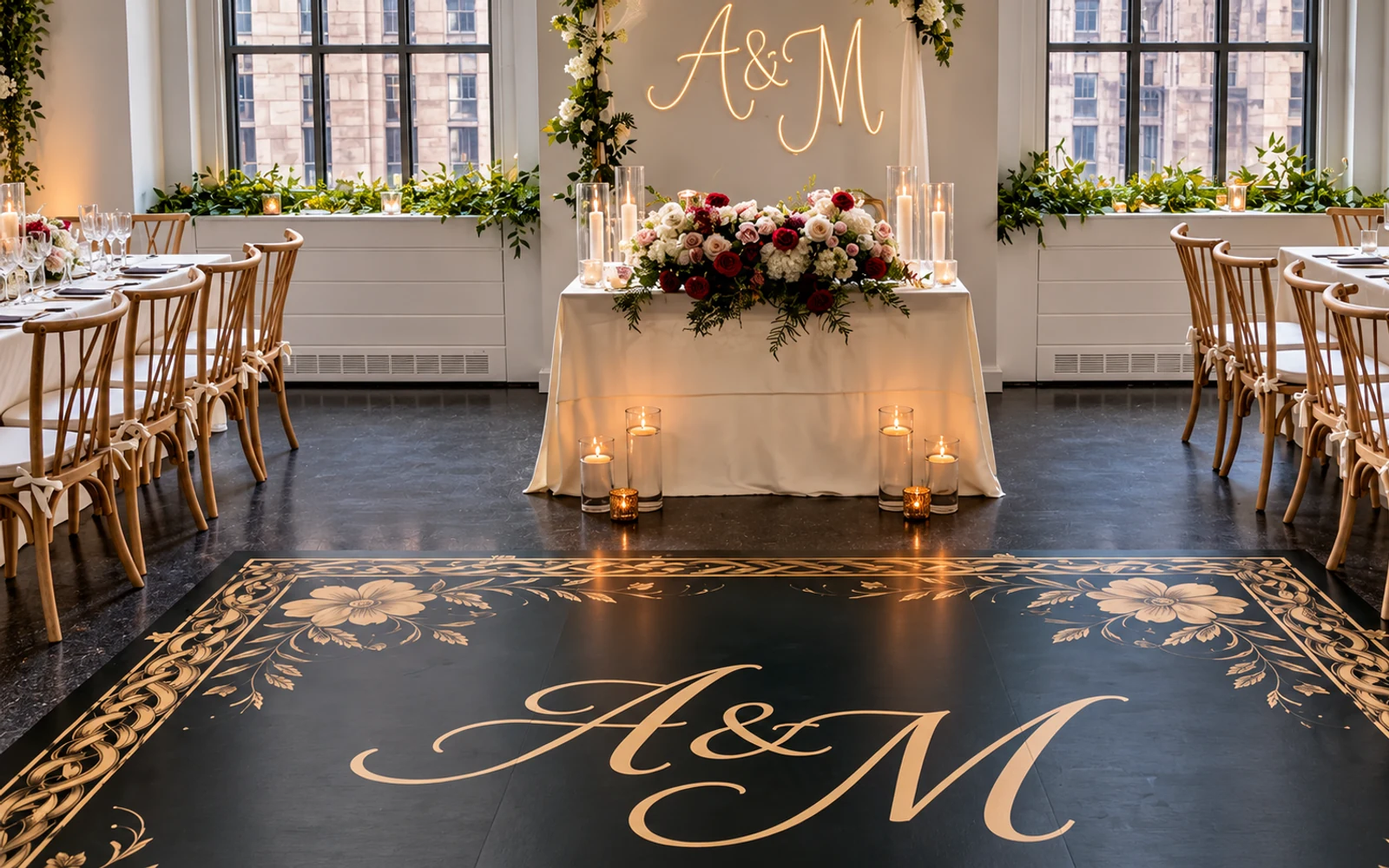Candlelit reception with a floral sweetheart table and custom monogram dance floor.